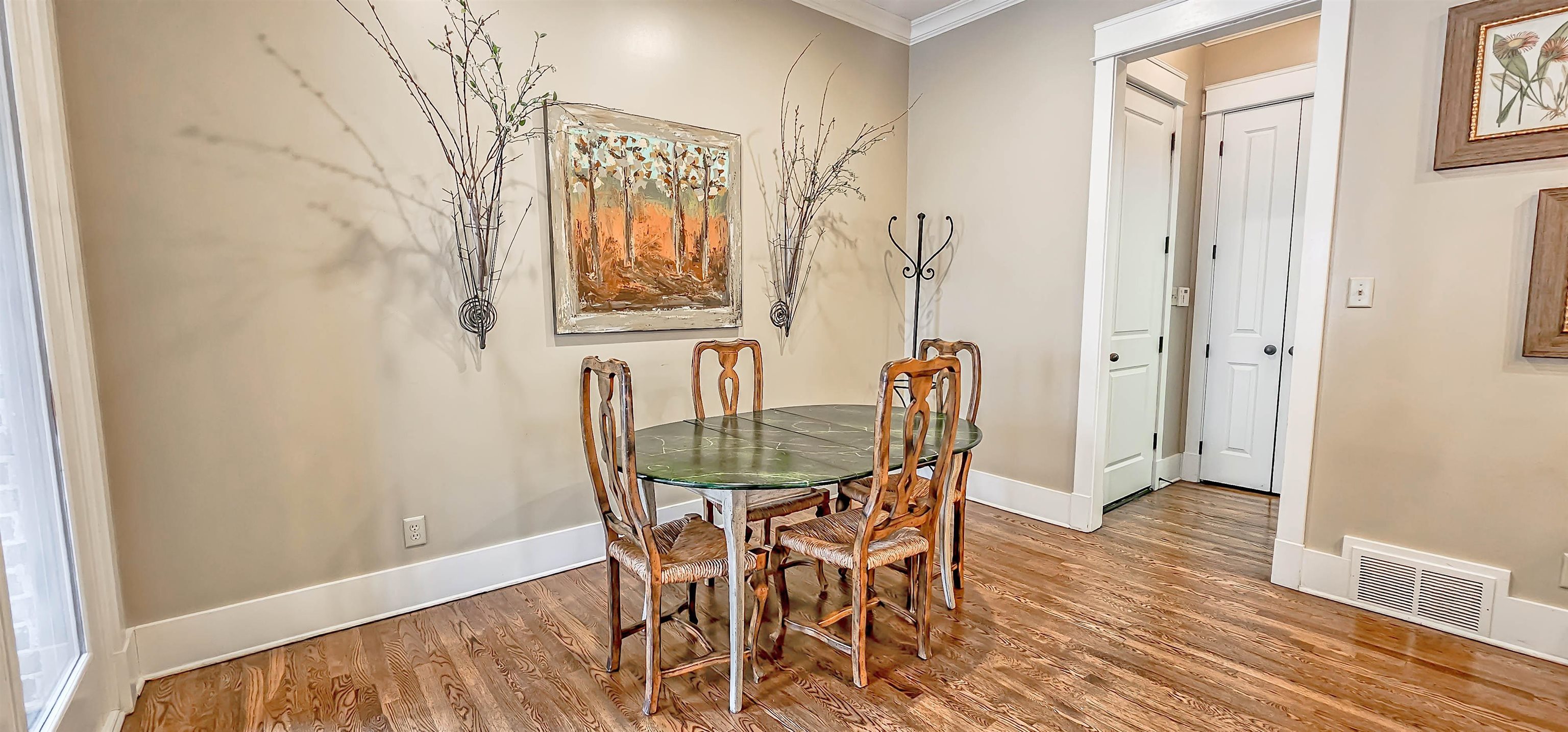 1784 Penshurst Drive Collierville, TN 38017 - Photo 16 of 40 a view of a dining room with furniture and wooden floor