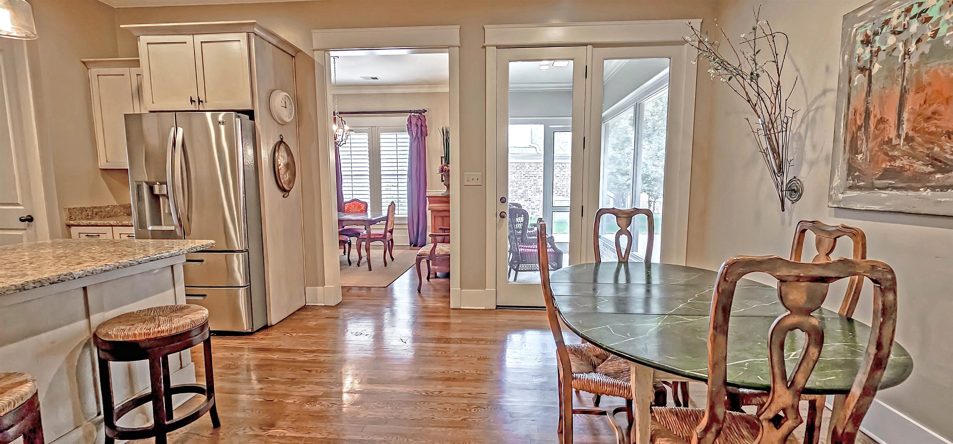 1784 Penshurst Drive Collierville, TN 38017 - Photo 17 of 40 a dining room with furniture and wooden floor