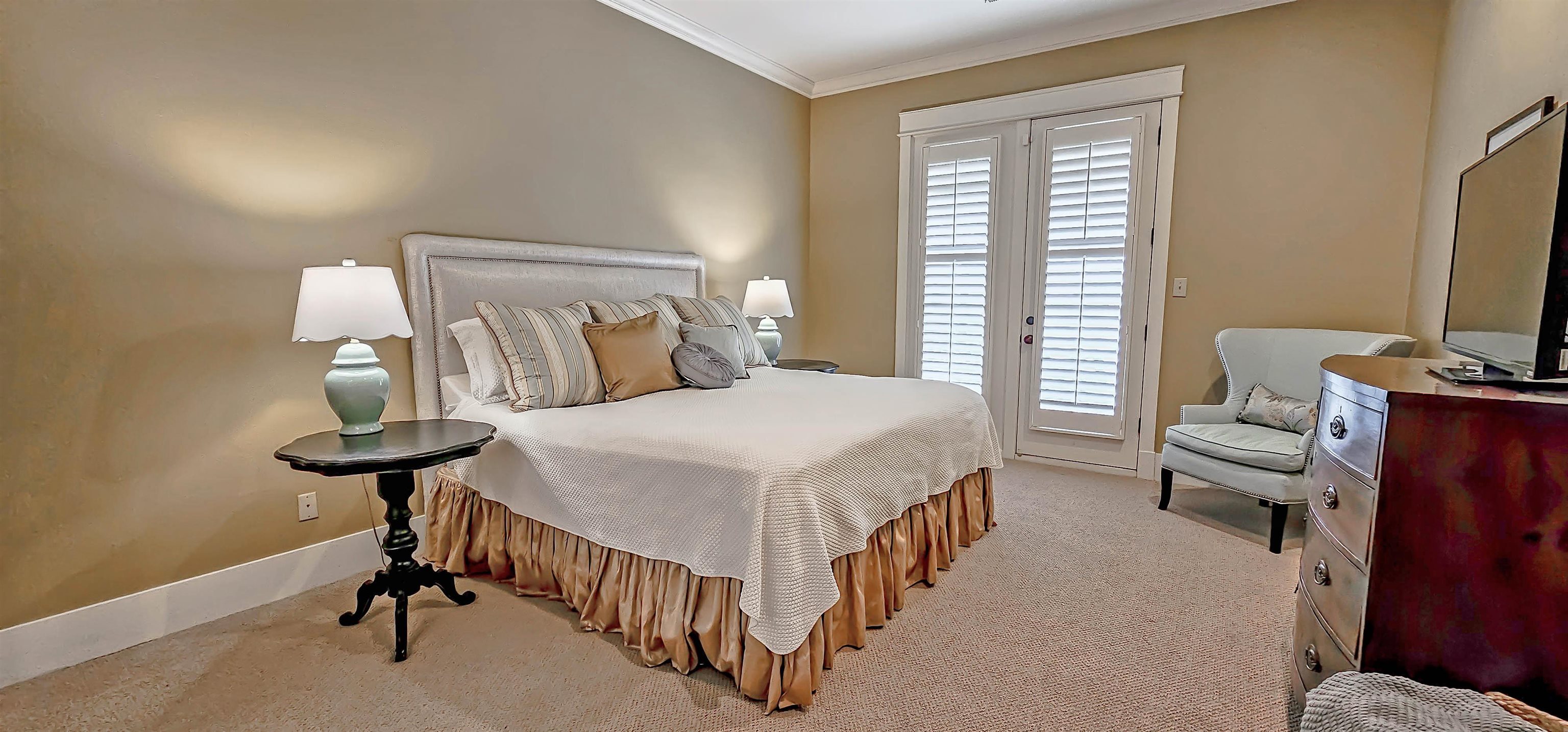 1784 Penshurst Drive Collierville, TN 38017 - Photo 20 of 40 a bedroom with a bed and a chandelier