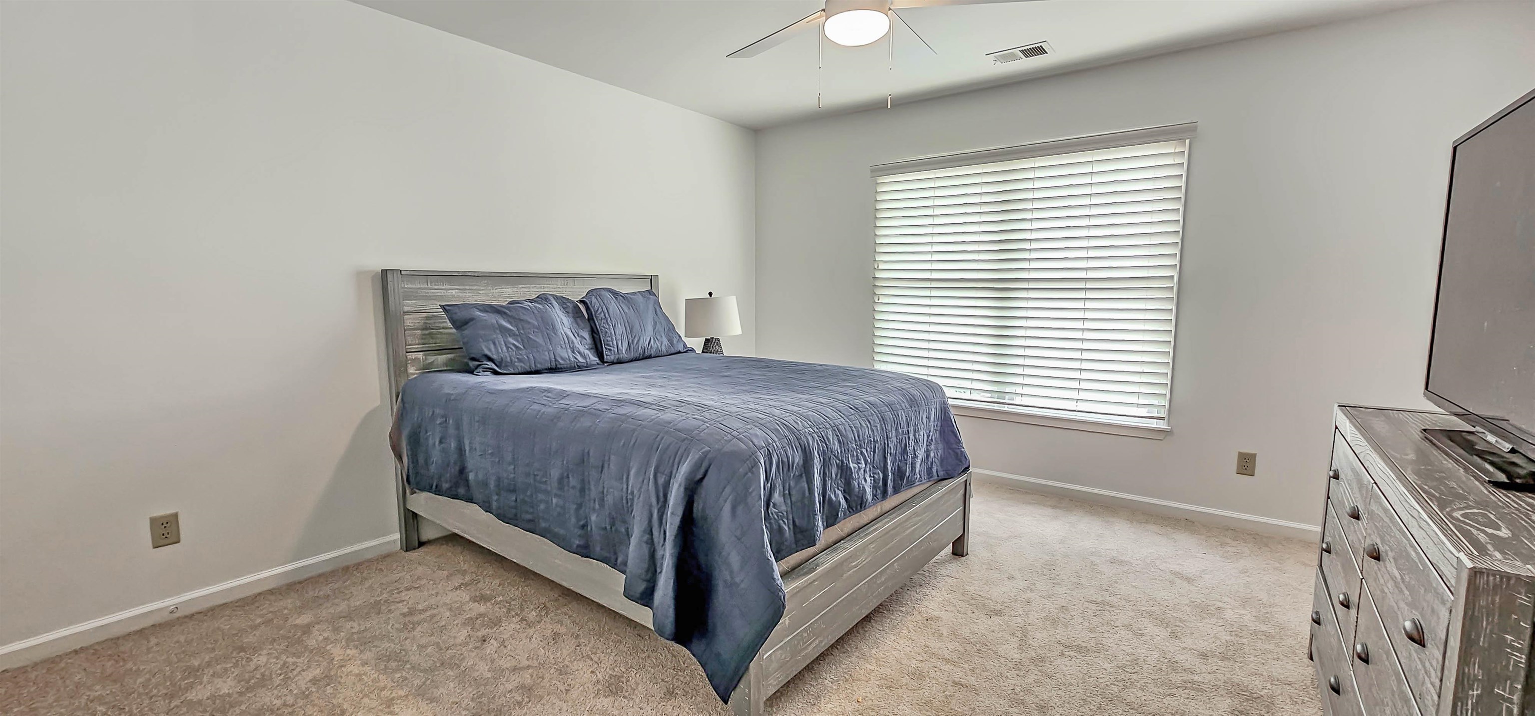 1784 Penshurst Drive Collierville, TN 38017 - Photo 27 of 40 a bed sitting in a bedroom next to a window