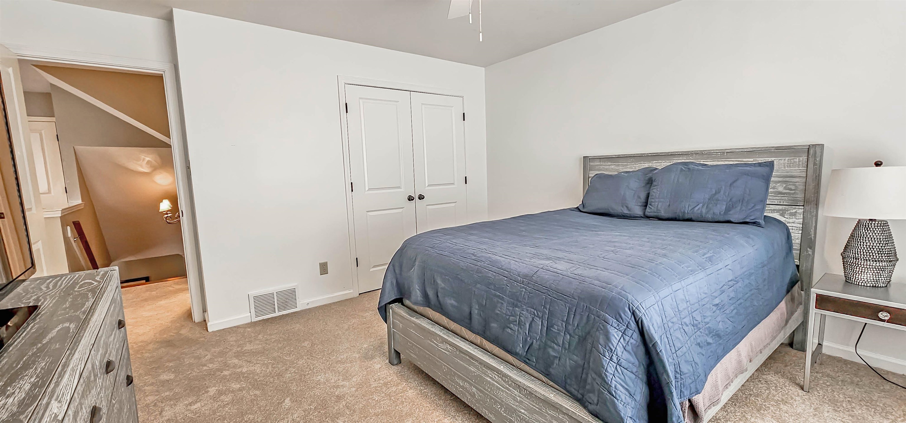 1784 Penshurst Drive Collierville, TN 38017 - Photo 28 of 40 a bedroom with a bed and a large mirror