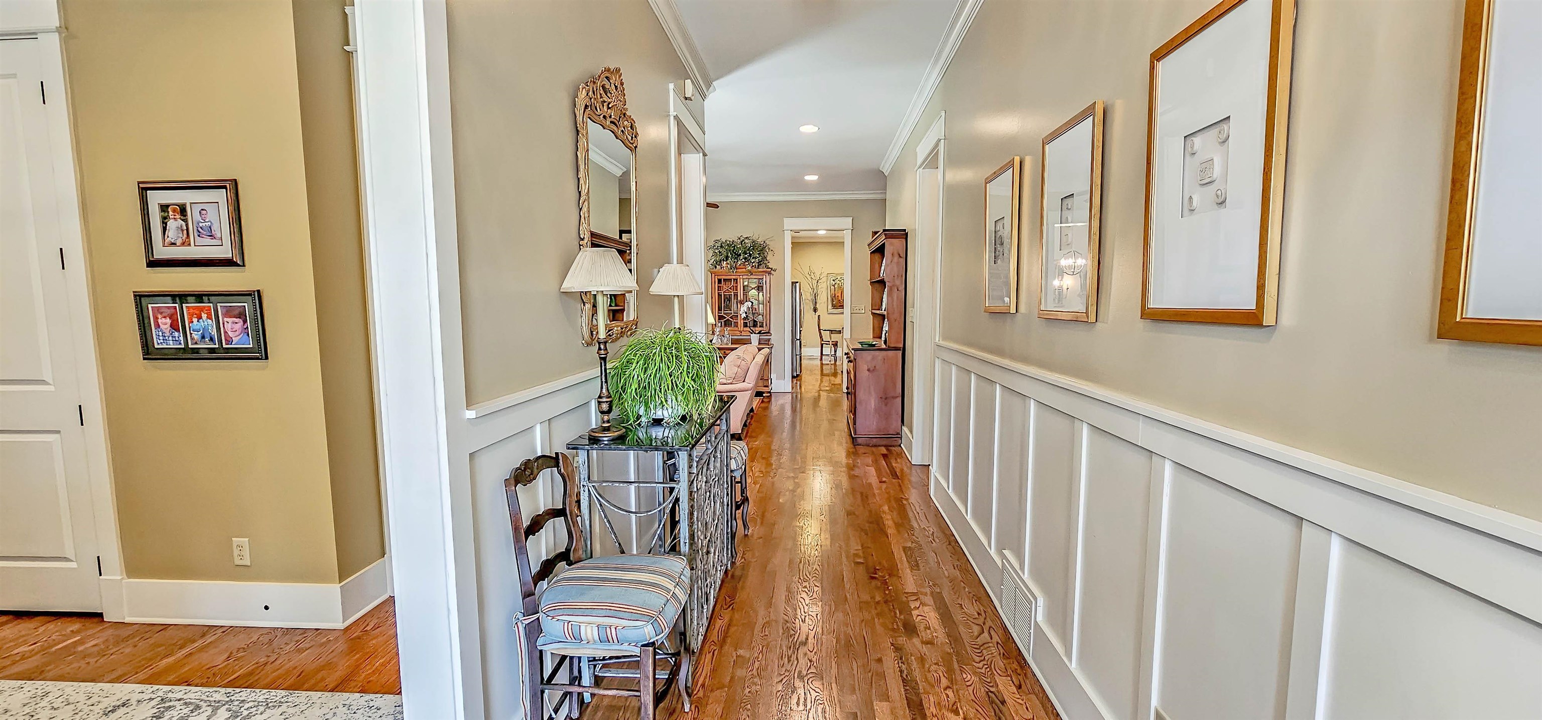 1784 Penshurst Drive Collierville, TN 38017 - Photo 5 of 40 a view of a hallway with wooden floor and windows