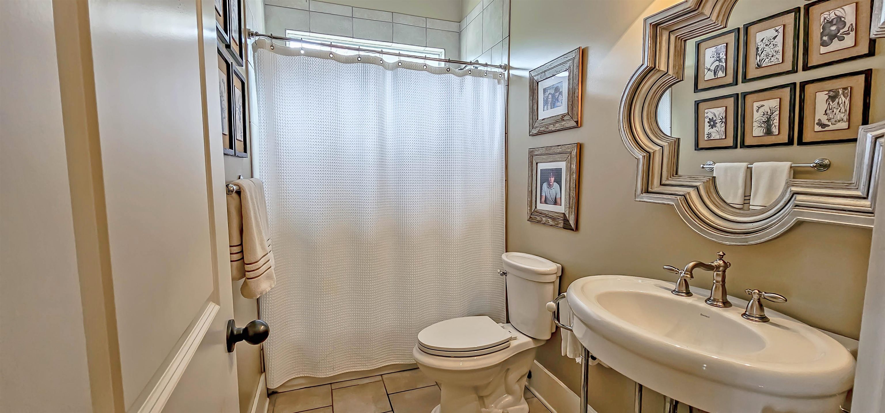 1784 Penshurst Drive Collierville, TN 38017 - Photo 7 of 40 a bathroom with a sink toilet and a mirror