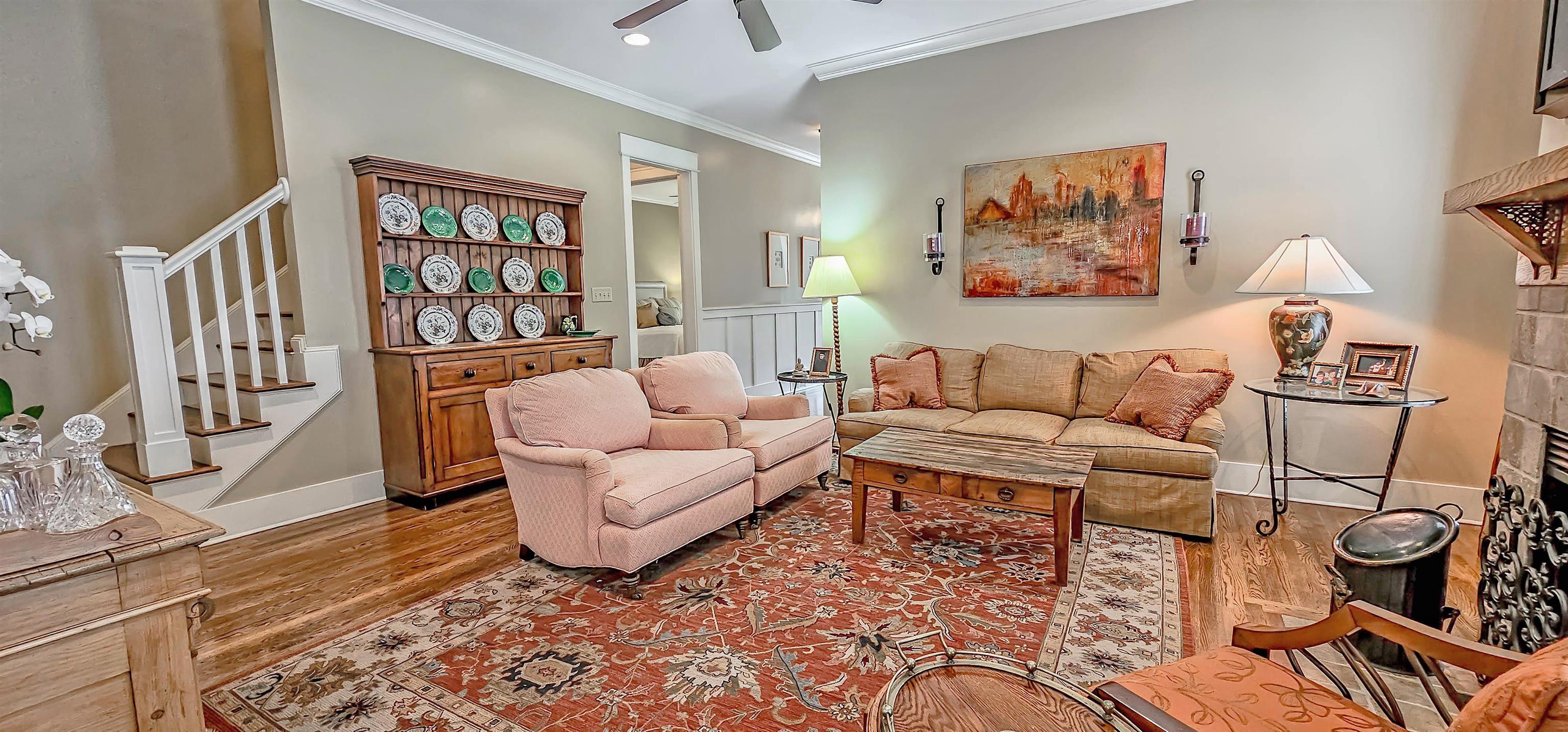 1784 Penshurst Drive Collierville, TN 38017 - Photo 9 of 40 a living room with furniture a rug and a bookshelf