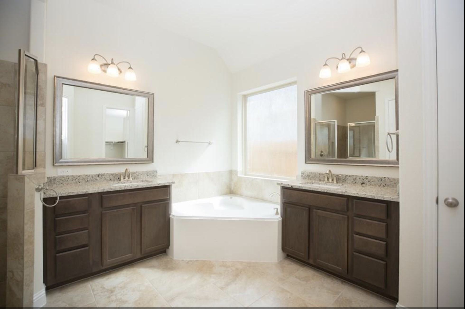 7438 Bethpage Lane Spring, TX 77389 - Photo 11 of 16 a bathroom with a tub sink and mirror