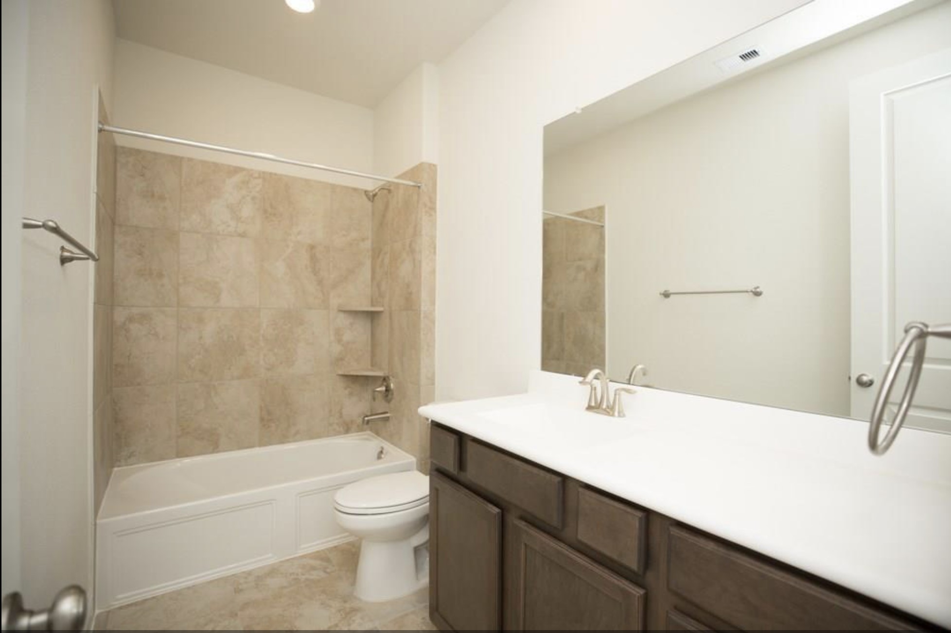 7438 Bethpage Lane Spring, TX 77389 - Photo 13 of 16 a bathroom with a sink a toilet and shower
