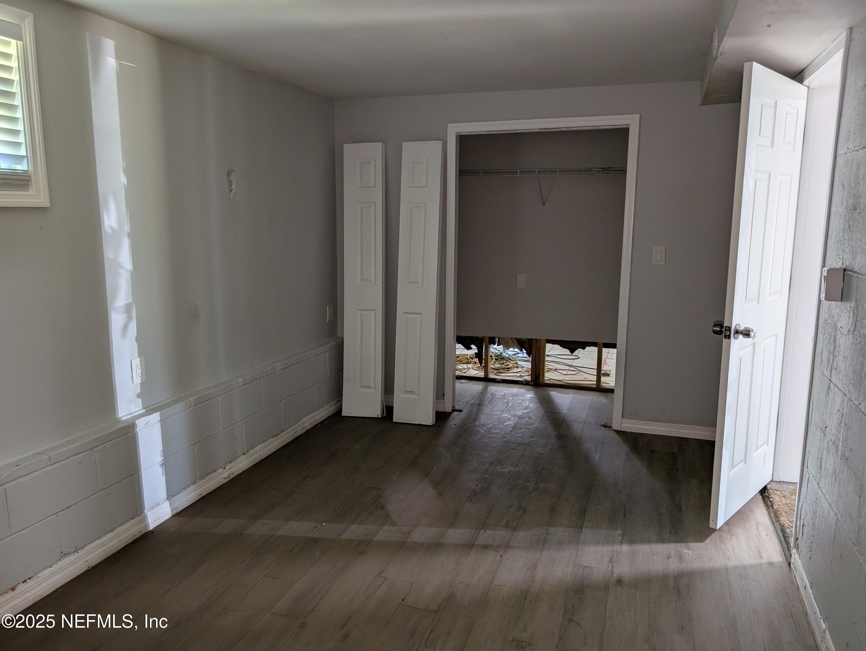 1339 Ellis Road South Jacksonville, FL 32205 - Photo 11 of 26 a view of a hallway with wooden floor and closet