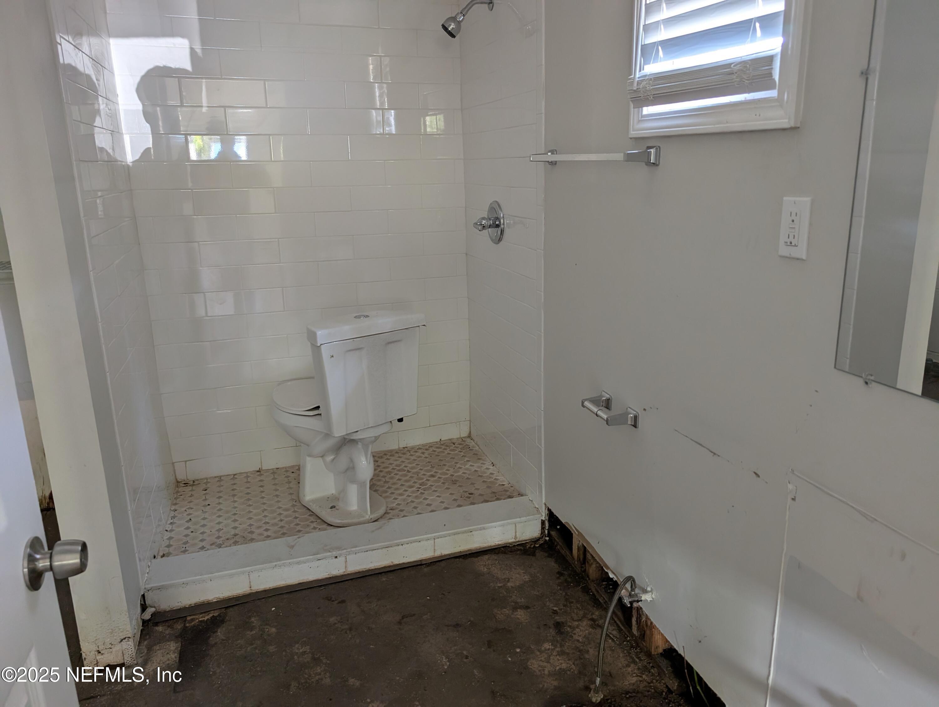 1339 Ellis Road South Jacksonville, FL 32205 - Photo 21 of 26 a bathroom with a sink and toilet