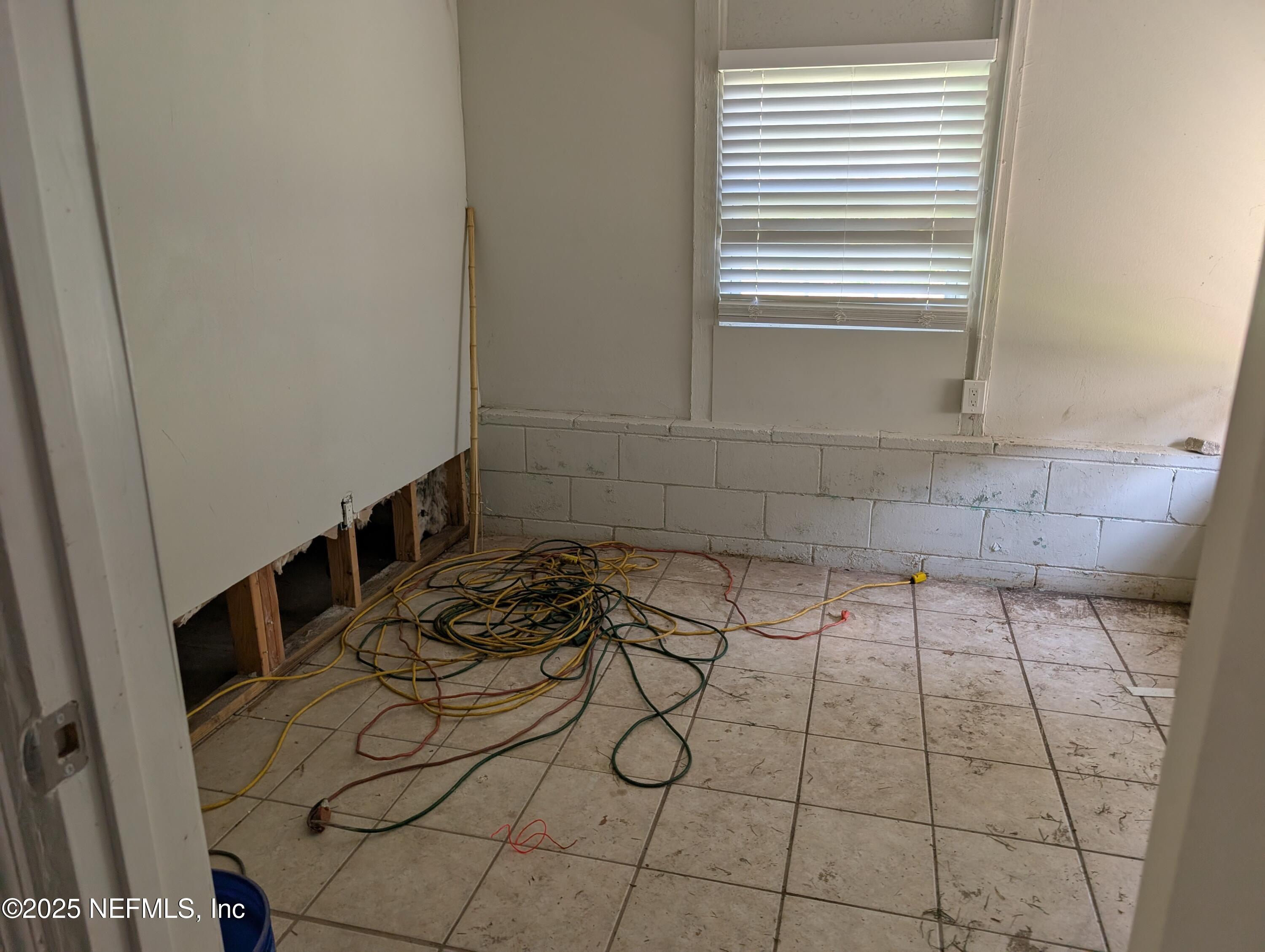 1339 Ellis Road South Jacksonville, FL 32205 - Photo 24 of 26 a bathroom with a sink and a window
