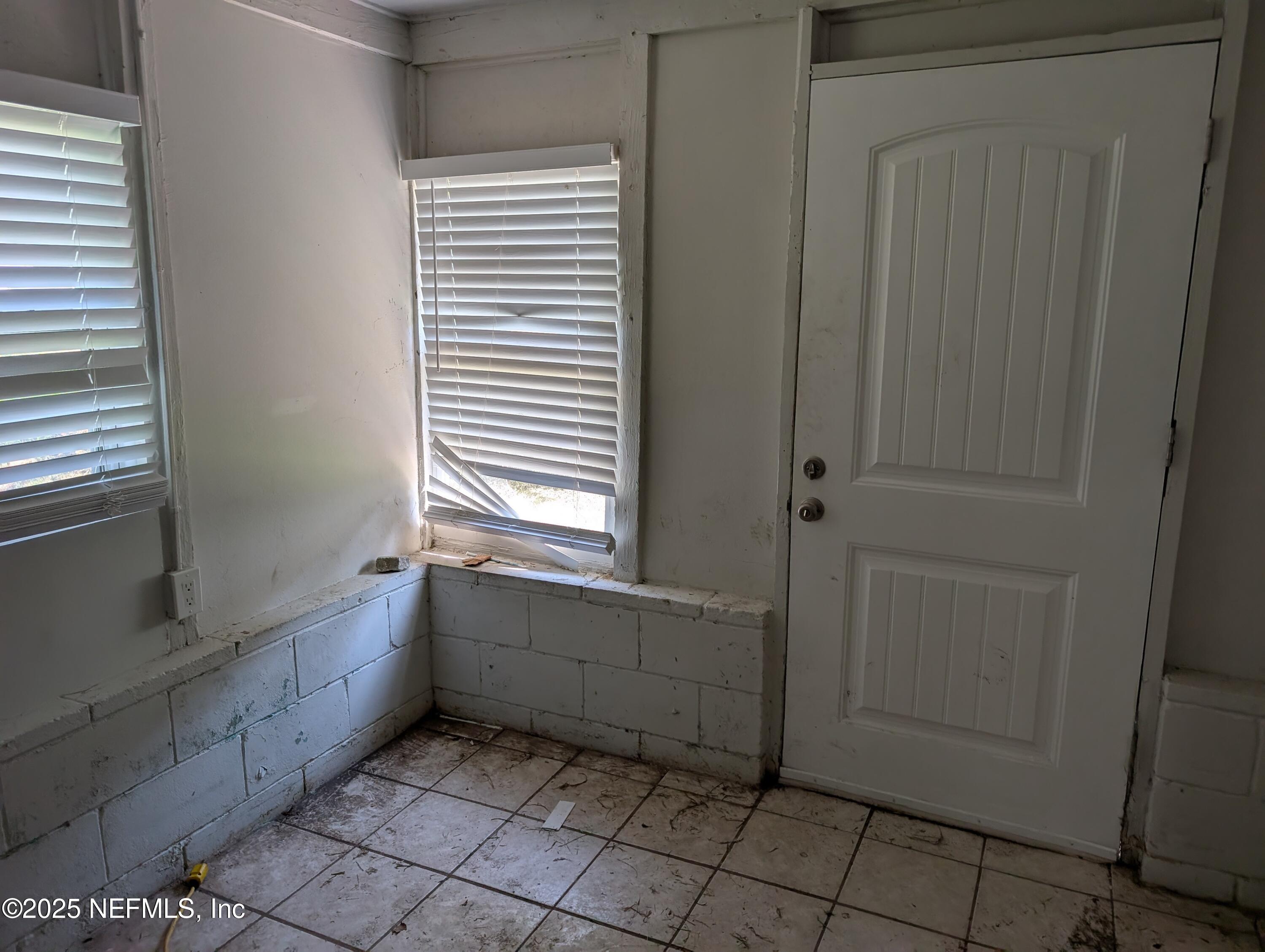 1339 Ellis Road South Jacksonville, FL 32205 - Photo 25 of 26 a bathroom with a bathtub and a window