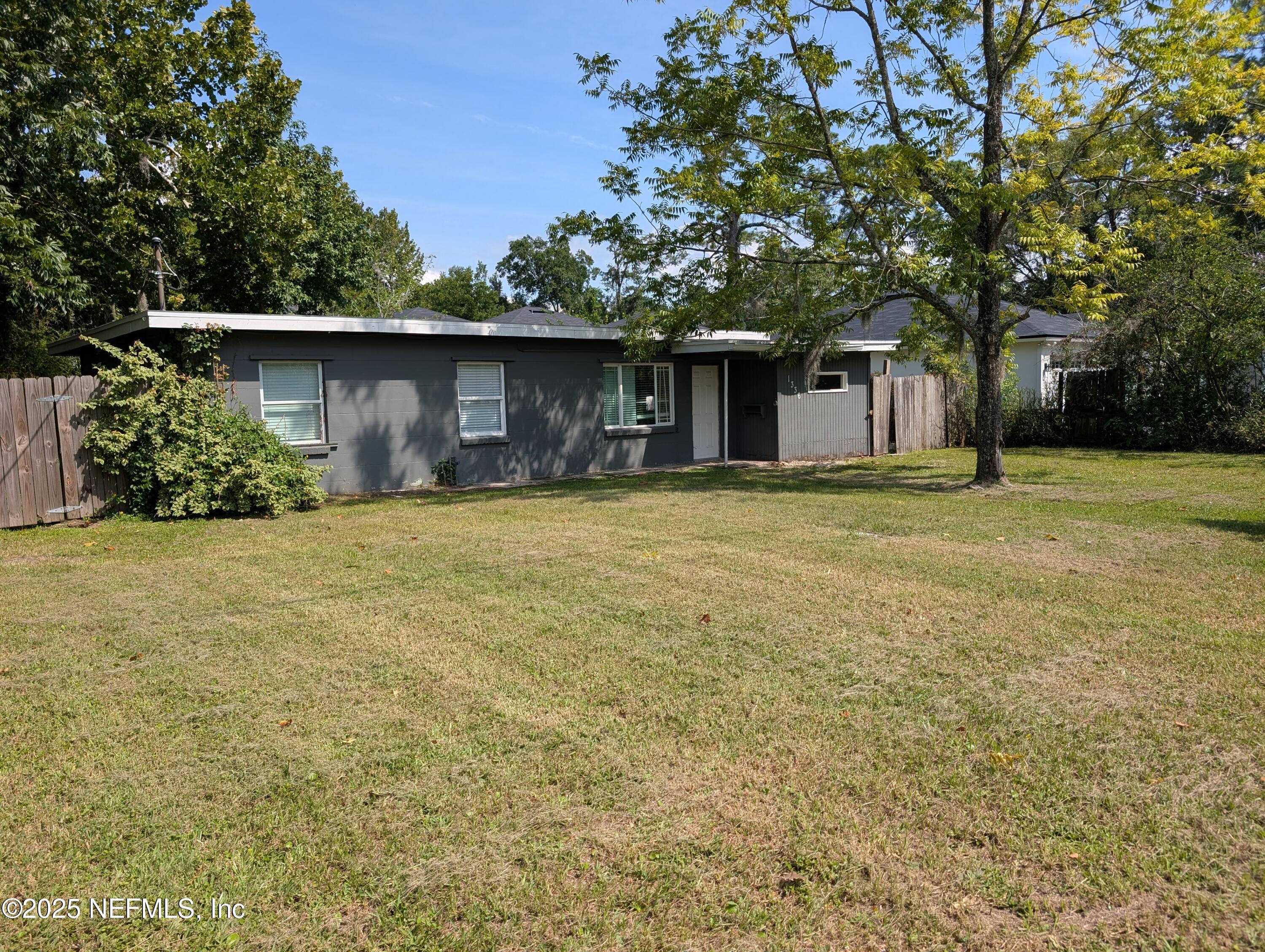 1339 Ellis Road South Jacksonville, FL 32205 - Photo 3 of 26 a house with a tree in front of it