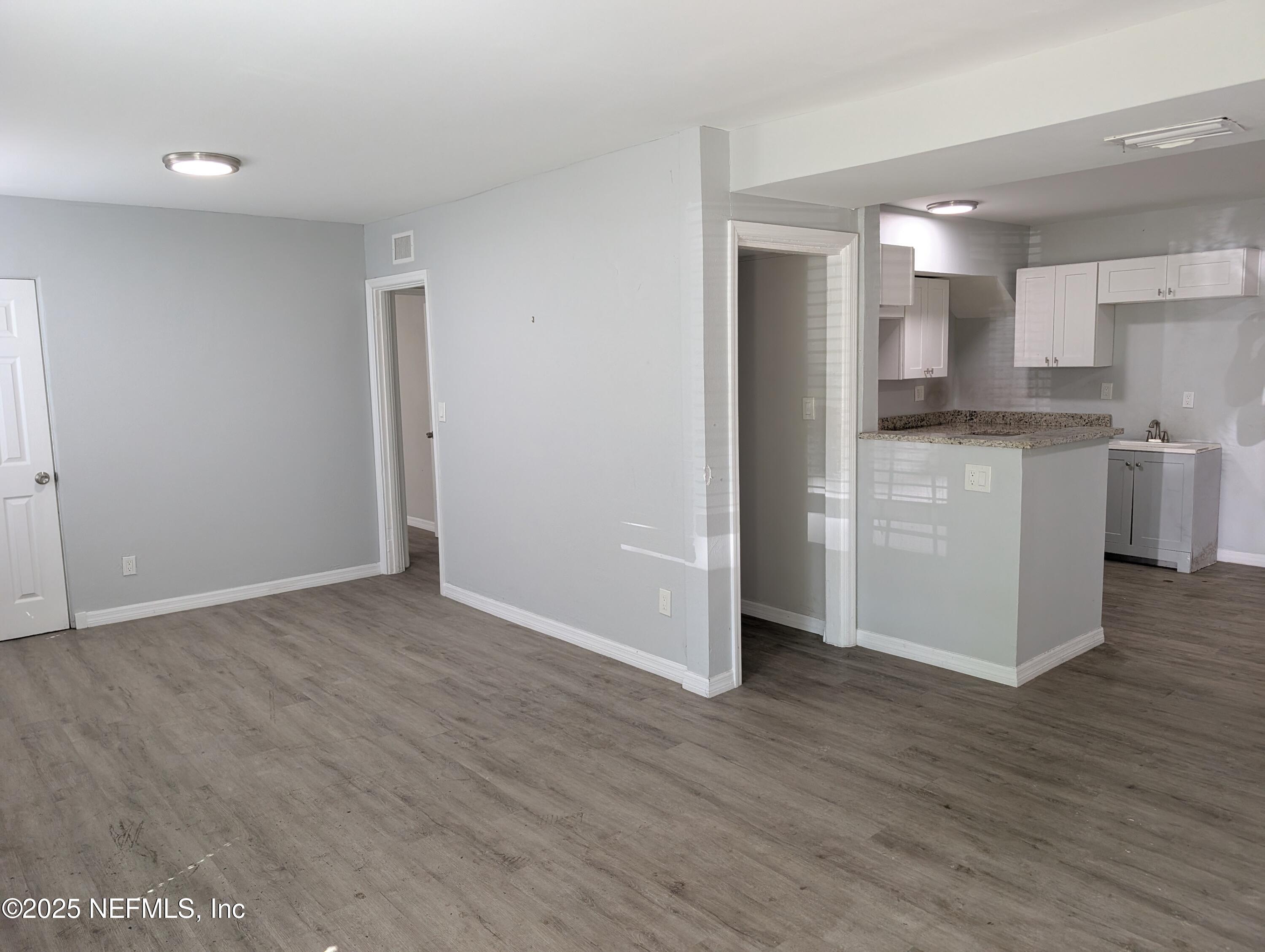 1339 Ellis Road South Jacksonville, FL 32205 - Photo 6 of 26 a view of kitchen with wooden floor