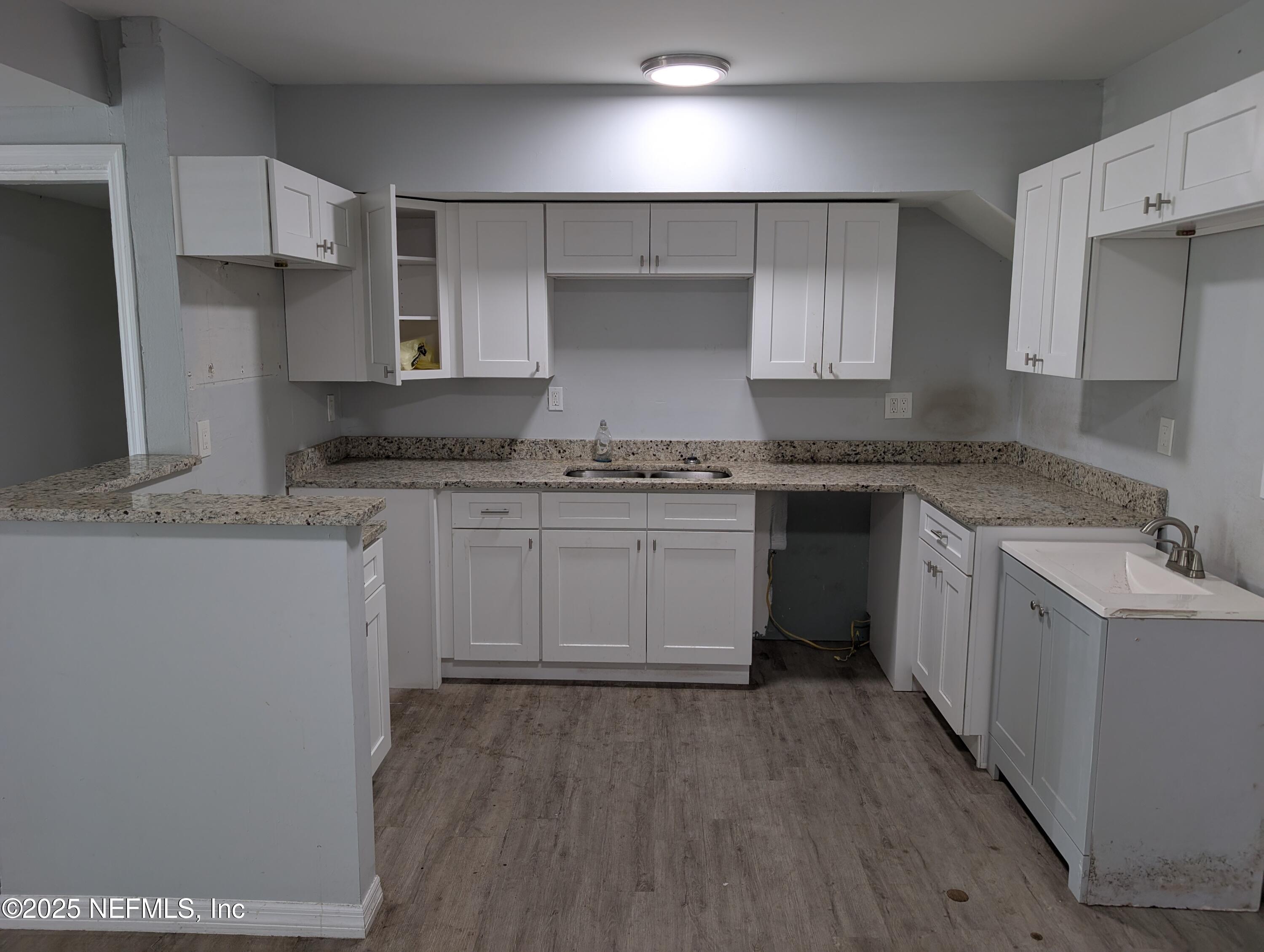1339 Ellis Road South Jacksonville, FL 32205 - Photo 8 of 26 a kitchen with stainless steel appliances granite countertop a stove a sink dishwasher and a refrigerator