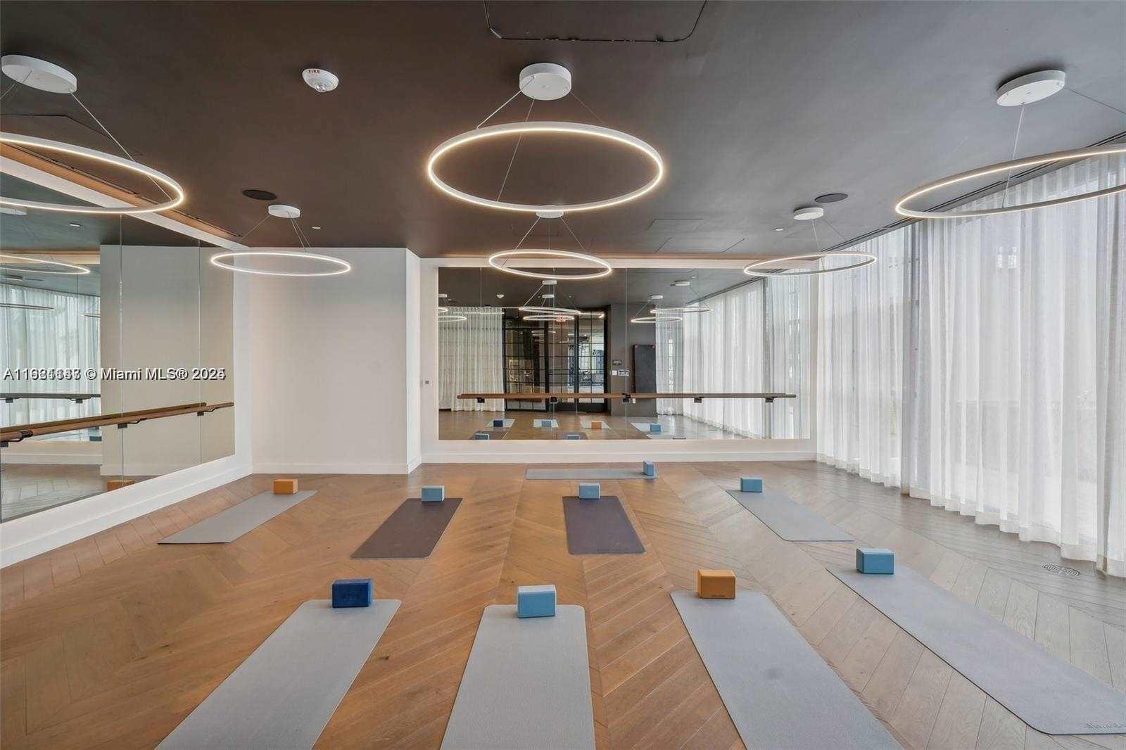 159 Northeast 6th Street, Unit 4114 Miami, FL 33132 - Photo 23 of 38 a very nice looking room with a large window and chandelier