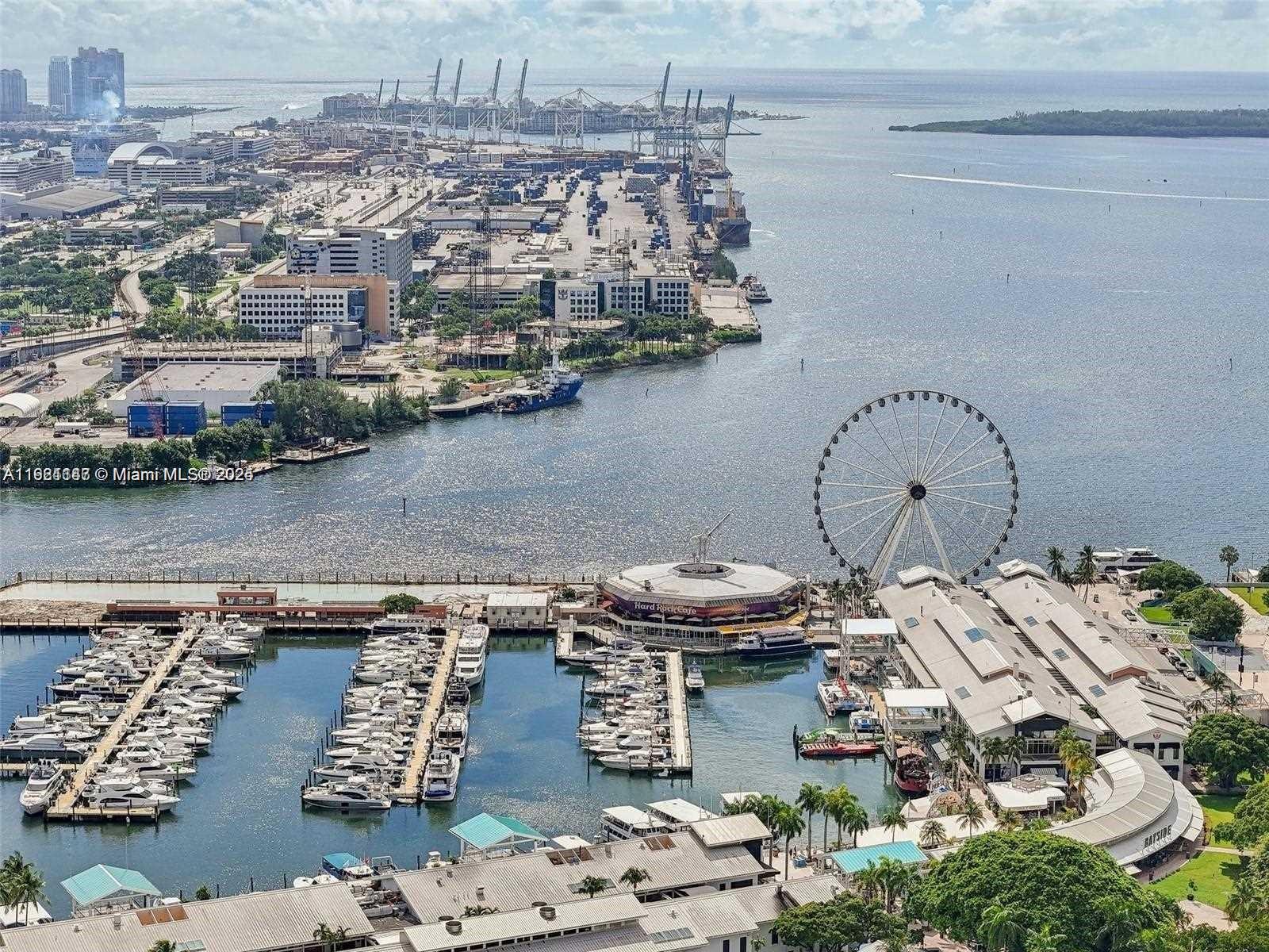 159 Northeast 6th Street, Unit 4114 Miami, FL 33132 - Photo 34 of 38 an aerial view of a house with a lake view