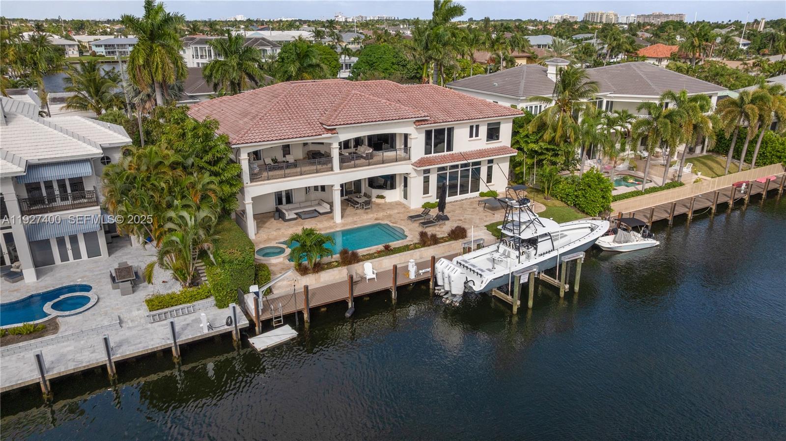 an aerial view of a house with pool table and chairs