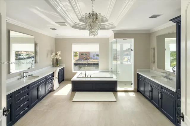 a large bathroom with a large tub and sink