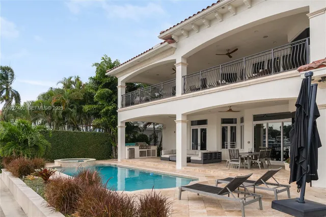 a view of a house with backyard sitting area and porch