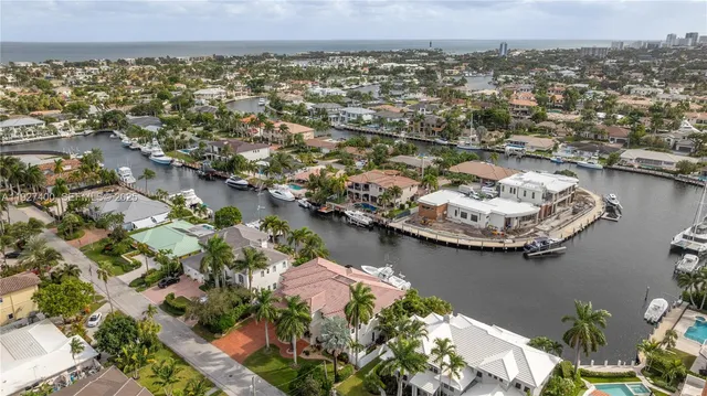 an aerial view of a house with a lake view