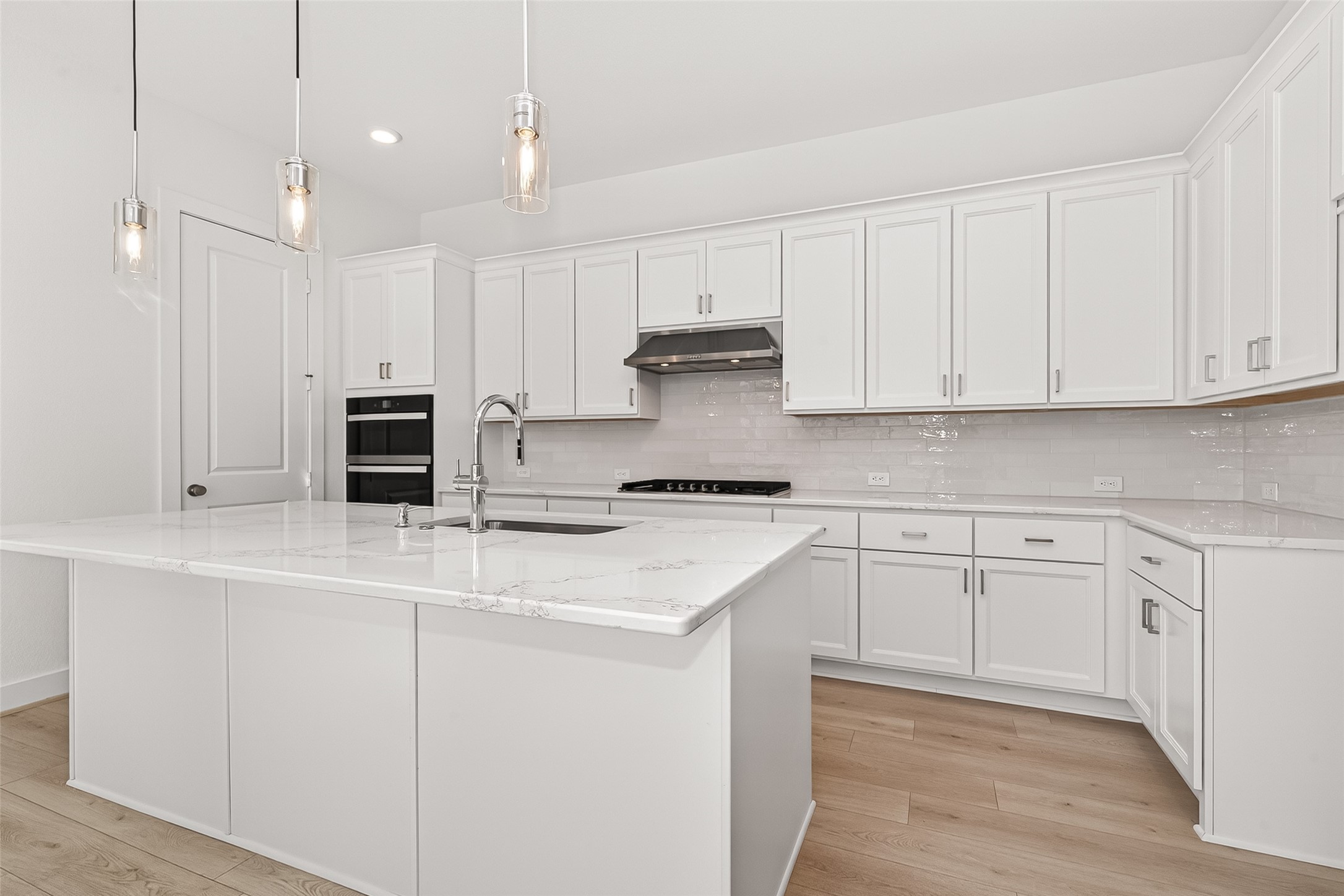 4916 Northern Wds Drive Spring, TX 77386 - Photo 13 of 44 a kitchen with stainless steel appliances granite countertop a stove a sink and white cabinets