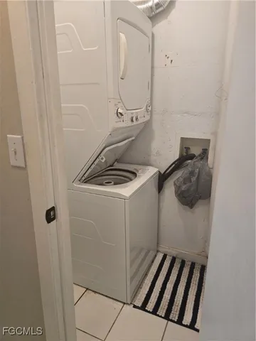 a white toilet sitting next to a shower