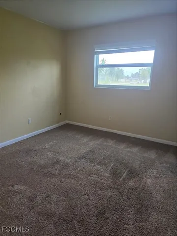 a view of an empty room and window