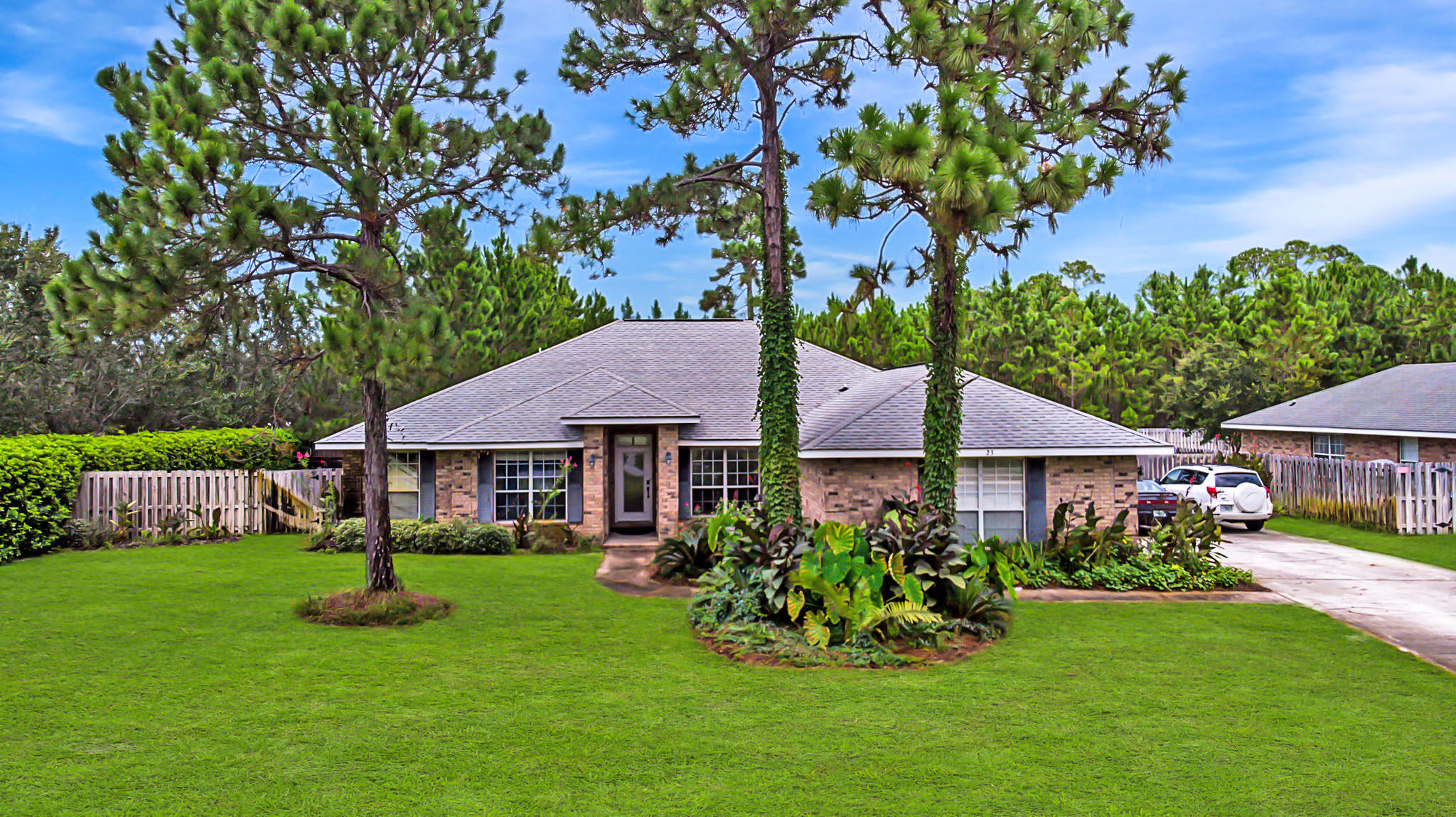 23 East Shipwreck Road Santa Rosa Beach, FL 32459 - Photo 1 of 21 a front view of a house with garden