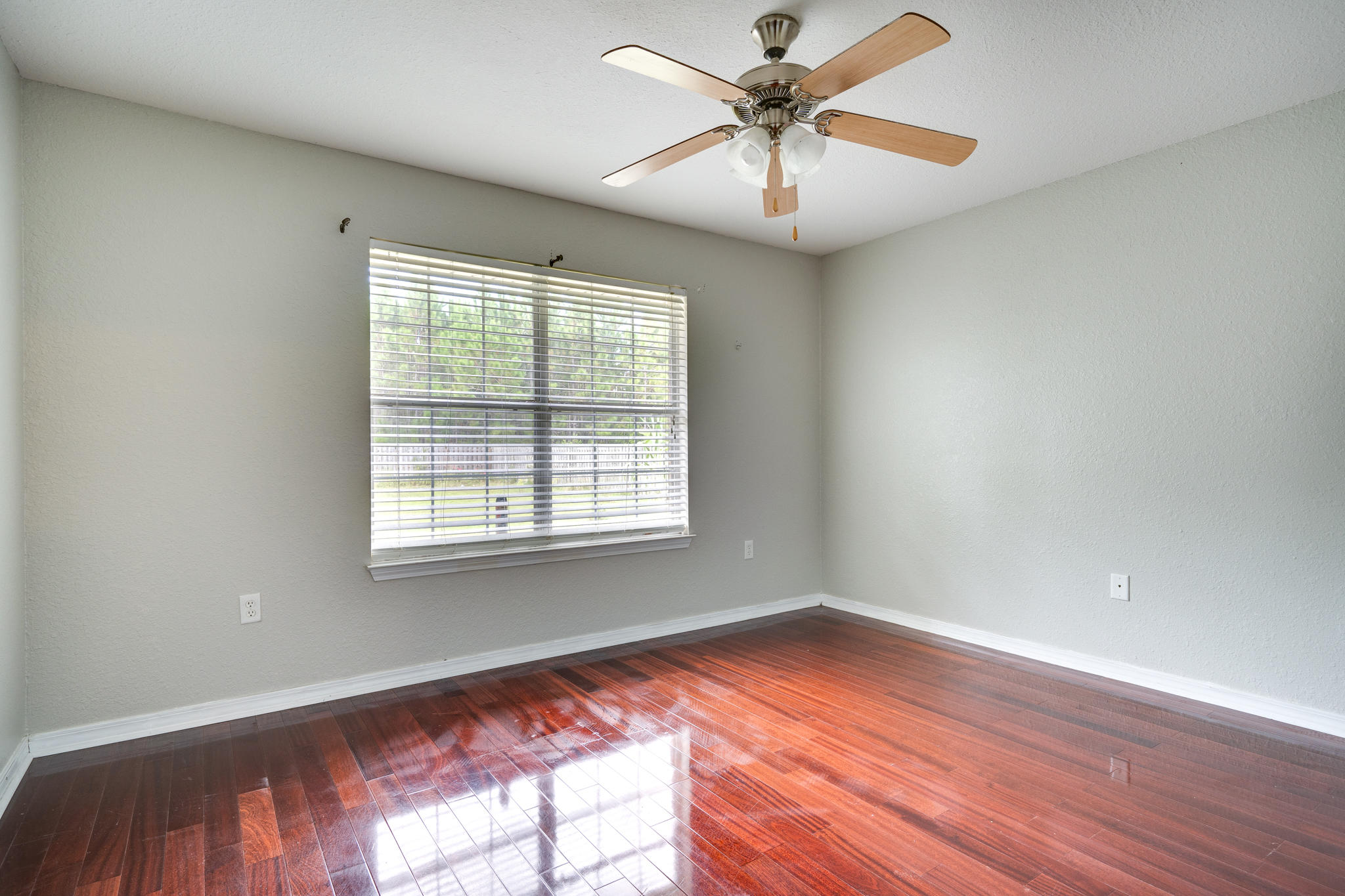 23 East Shipwreck Road Santa Rosa Beach, FL 32459 - Photo 14 of 21 wooden floor in an empty room with a window