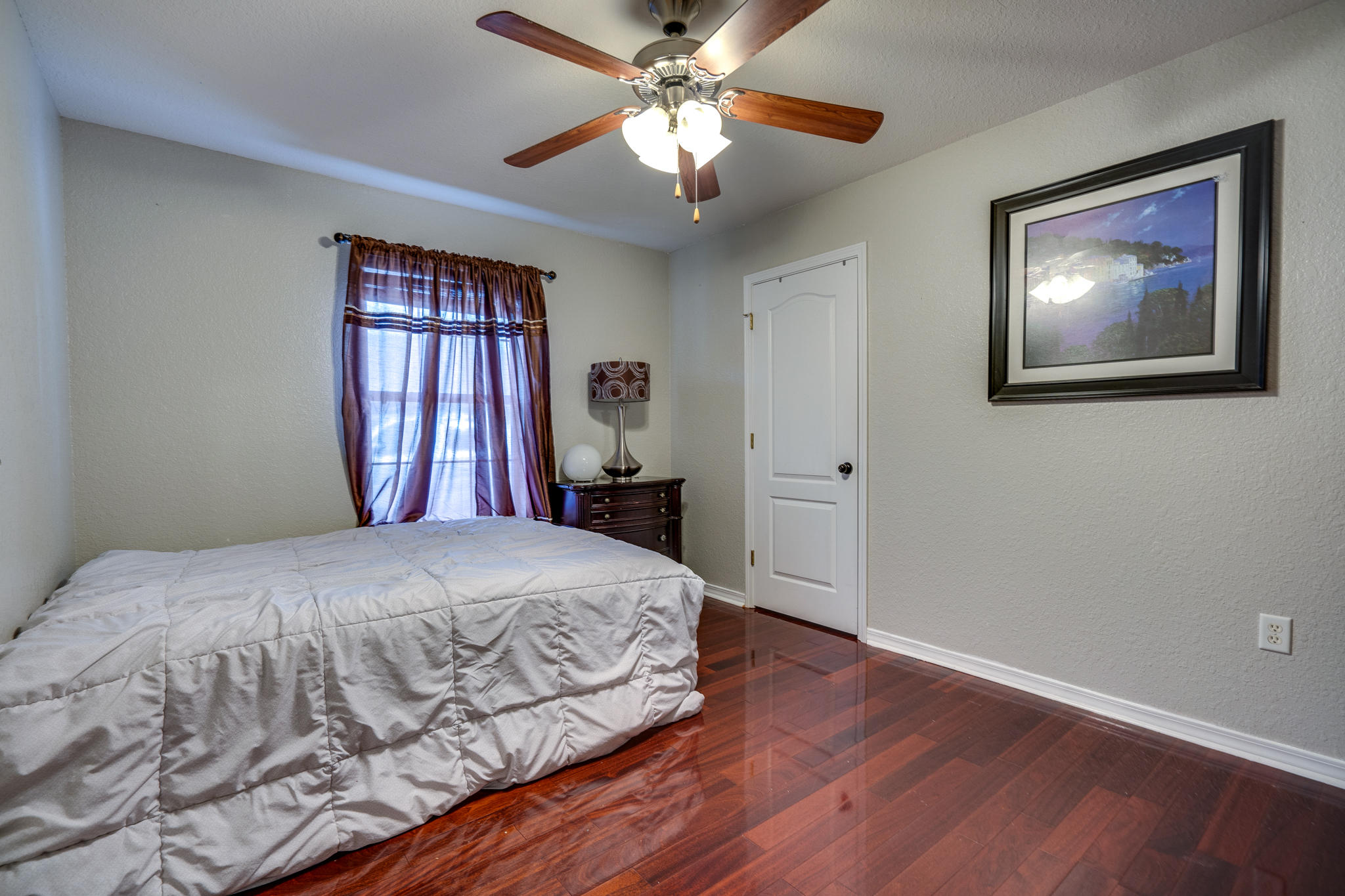 23 East Shipwreck Road Santa Rosa Beach, FL 32459 - Photo 10 of 21 a bedroom with a large bed and a chandelier