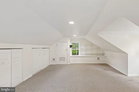 a view of entryway with wooden floor and stairs