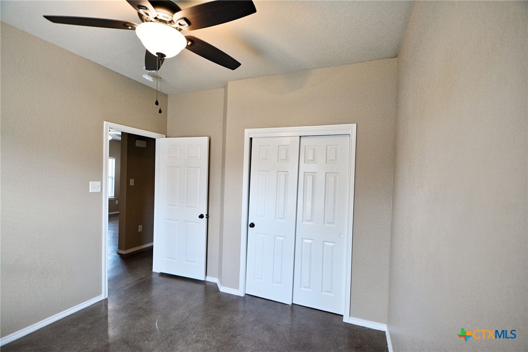 107 Rosedale Avenue New Braunfels, TX 78130 - Photo 15 of 21 an empty room with closet and a ceiling fan