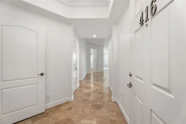 a view of a hallway with wooden shelves