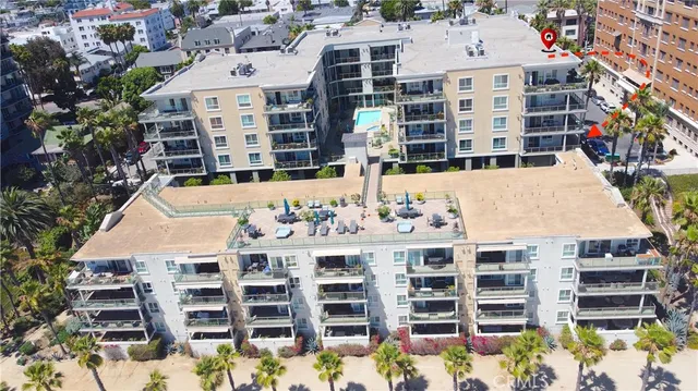 a front view of a residential apartment building with a yard
