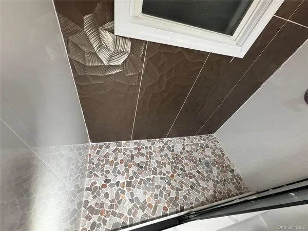 a bathroom with a toilet a sink and a mirror