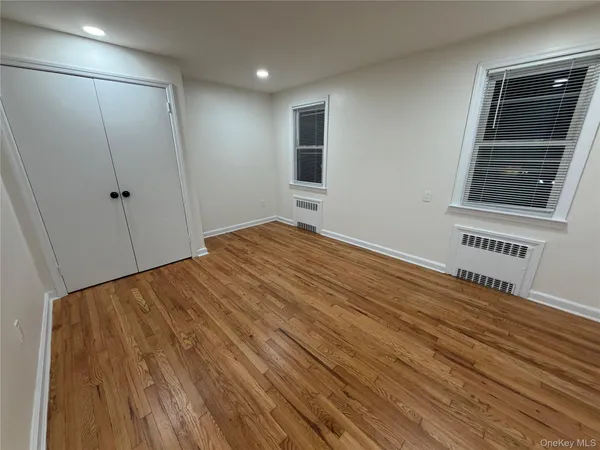 a view of a room with wooden floor and staircase