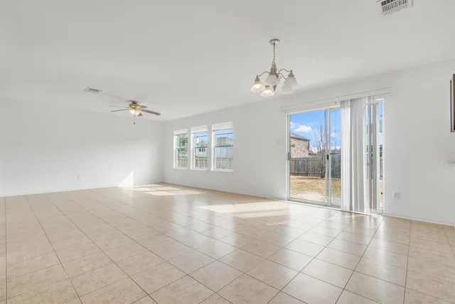 a view of an empty room with glass door
