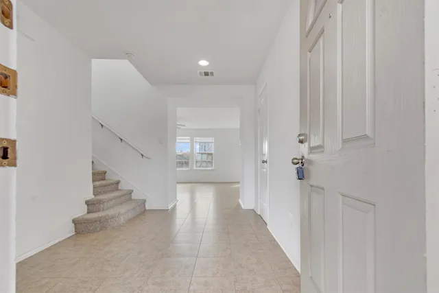 a view of a hallway with staircase