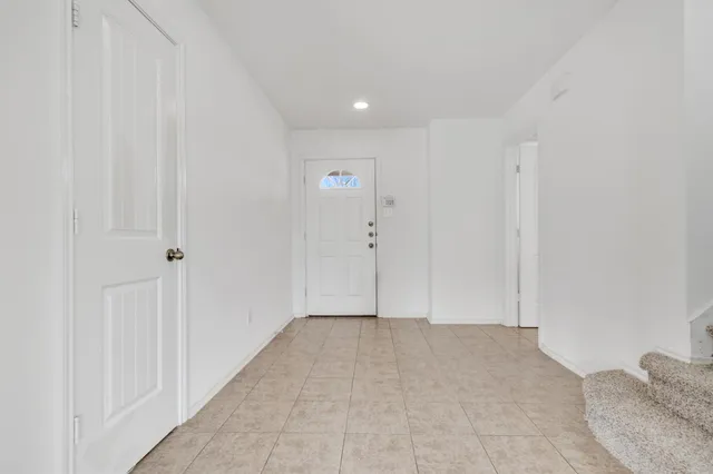 a bathroom with a granite countertop sink a toilet and a mirror