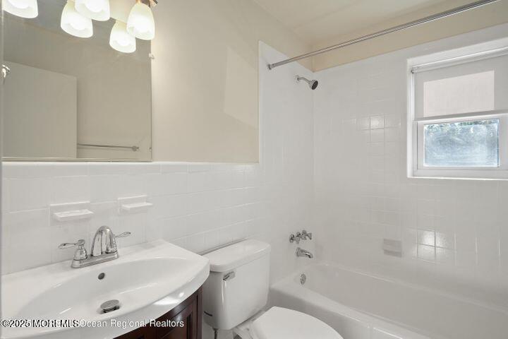 151 Spring Lake Garden Court, Unit 119 Spring Lake, NJ 07762 - Photo 4 of 8 a bathroom with a sink toilet and shower