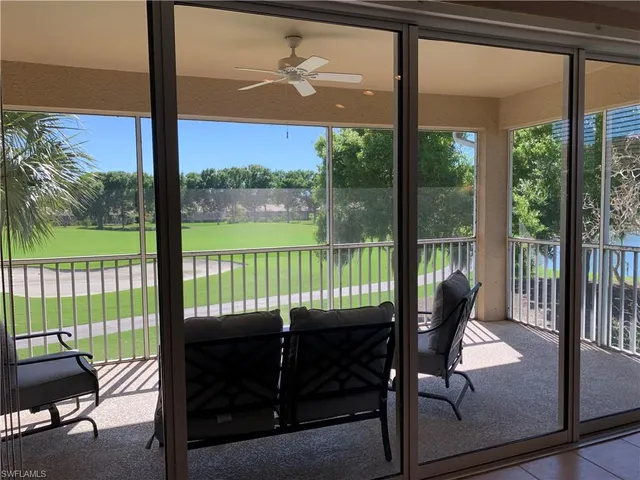 a view of a room with balcony and furniture