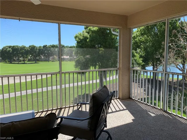 a view of a two chairs in the balcony