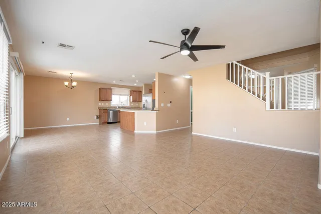 a view of a kitchen with a sink and a window