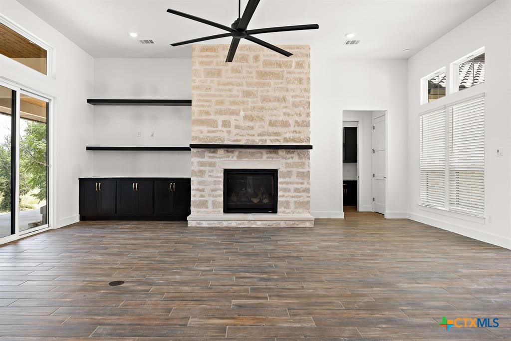 120 Strada Luca Florence, TX 76527 - Photo 9 of 17 a view of an empty room with glass door and wooden floor