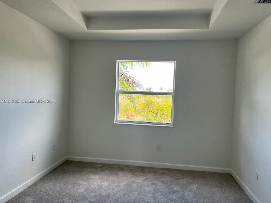 2633 Southeast 10th Street, Unit 2633 Homestead, FL 33035 - Photo 12 of 42 an empty room with a window