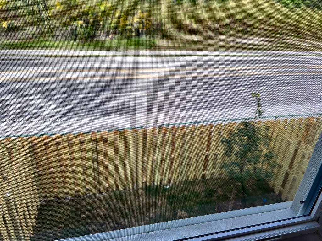 2633 Southeast 10th Street, Unit 2633 Homestead, FL 33035 - Photo 13 of 42 a view of a garden from a window
