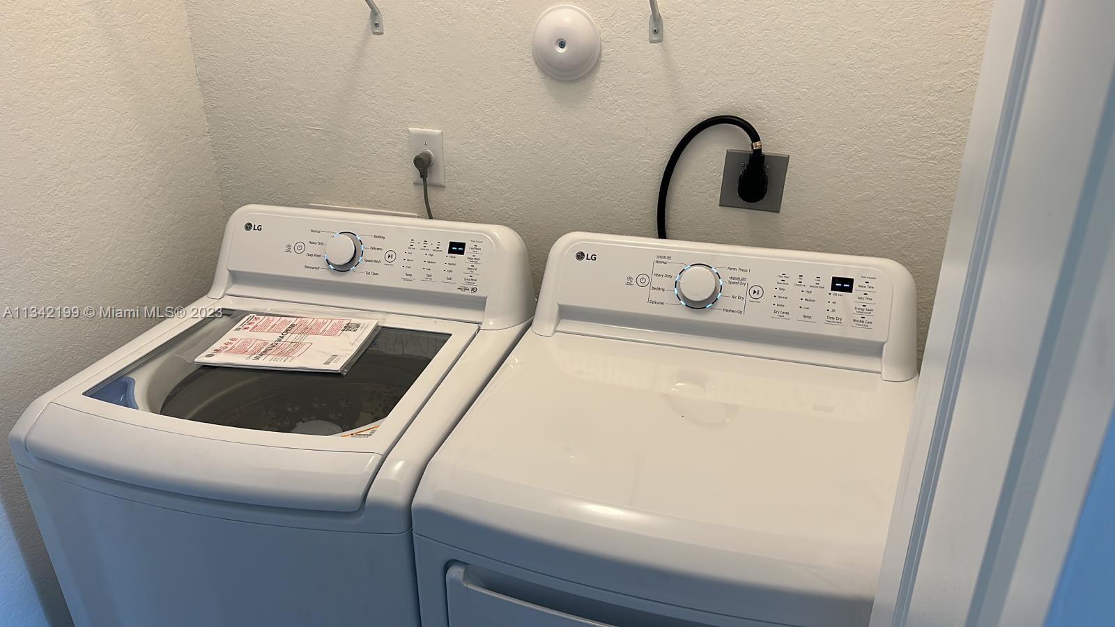 2633 Southeast 10th Street, Unit 2633 Homestead, FL 33035 - Photo 17 of 42 a utility room with dryer and washer