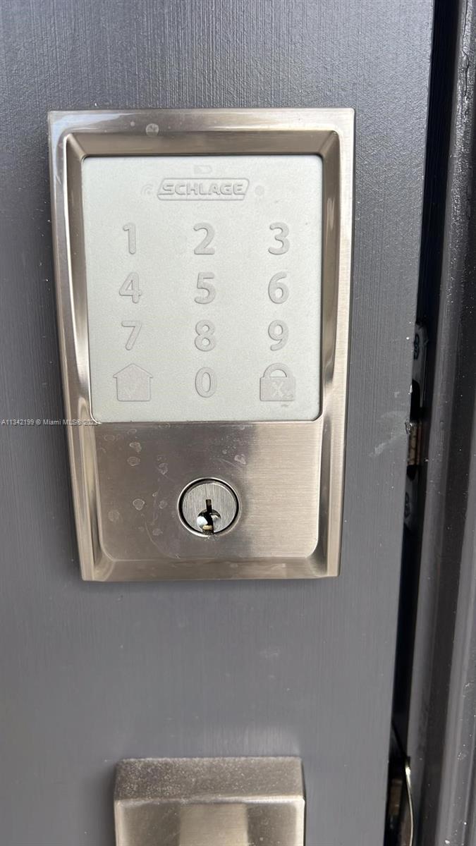 2633 Southeast 10th Street, Unit 2633 Homestead, FL 33035 - Photo 24 of 42 a close view of door lock