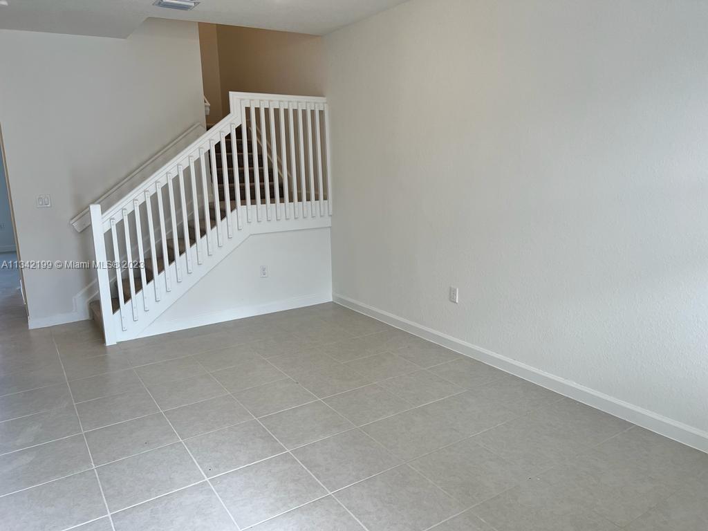 2633 Southeast 10th Street, Unit 2633 Homestead, FL 33035 - Photo 3 of 42 a view of entryway with stairs