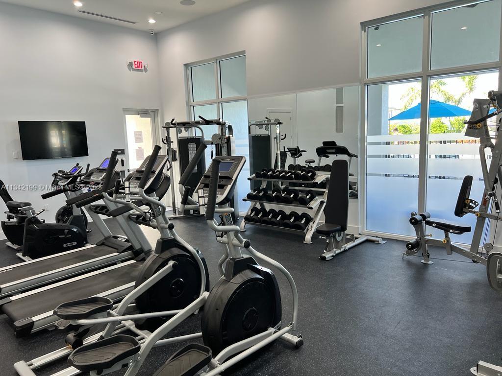 2633 Southeast 10th Street, Unit 2633 Homestead, FL 33035 - Photo 34 of 42 a view of a room with gym equipment