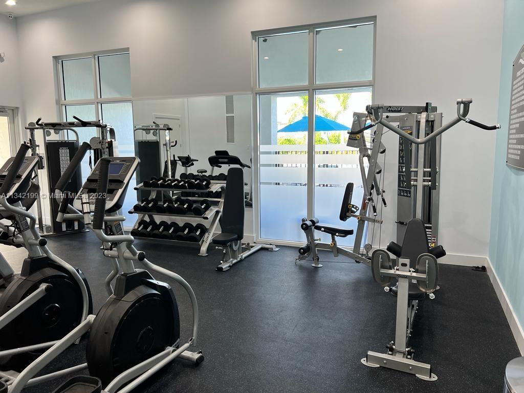 2633 Southeast 10th Street, Unit 2633 Homestead, FL 33035 - Photo 35 of 42 a view of a room with gym equipment